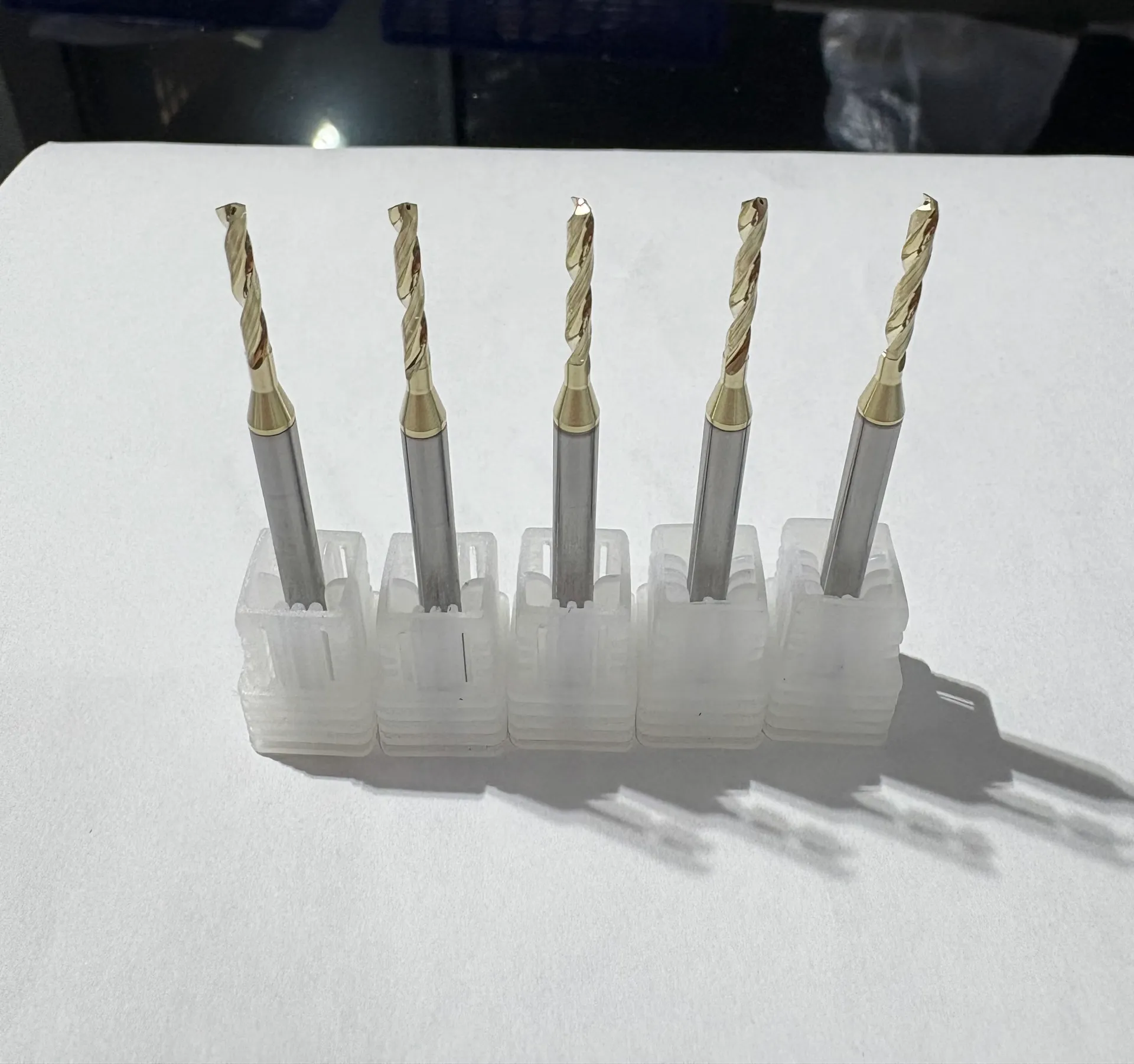 Custom 2mm coolant-thru solid carbide drills for titanium with bright gold PVD coating